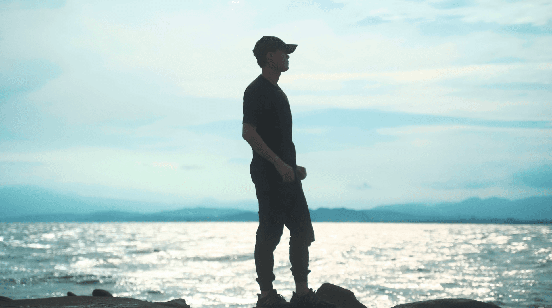 Daniel Chin silhouette at ocean